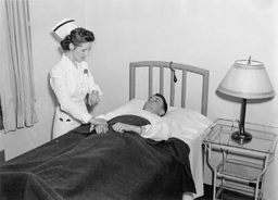 Nurse attending to Soldier in Infirmary