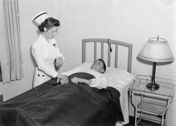 Nurse attending to Soldier in Infirmary