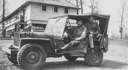 Camp Forrest, Tennessee- Men sitting in a Jeep